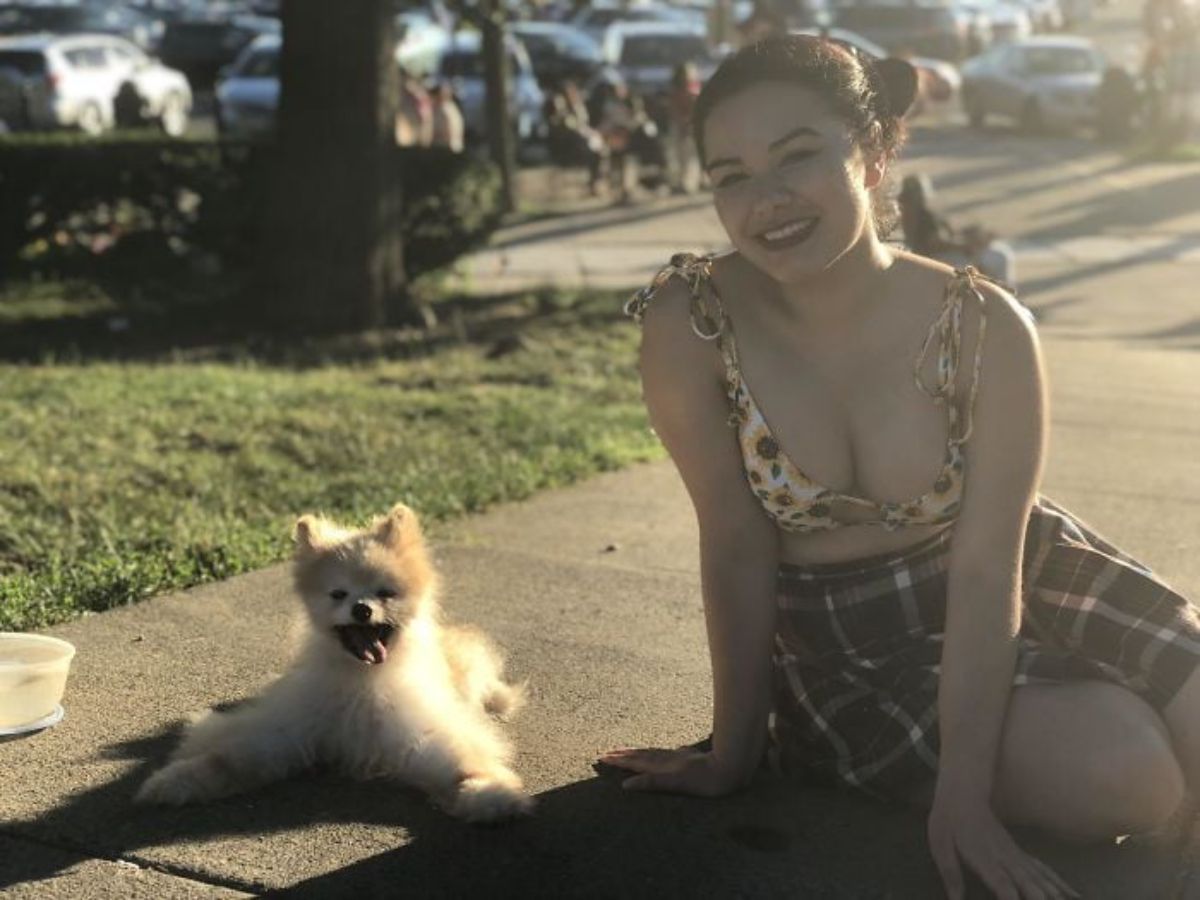 light brown pomeranian with a woman