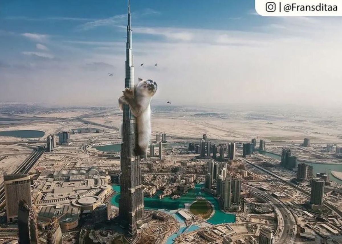giant photoshopped cream and black siamese cat hanging on to a tall skyscraper with helicopters circling its head