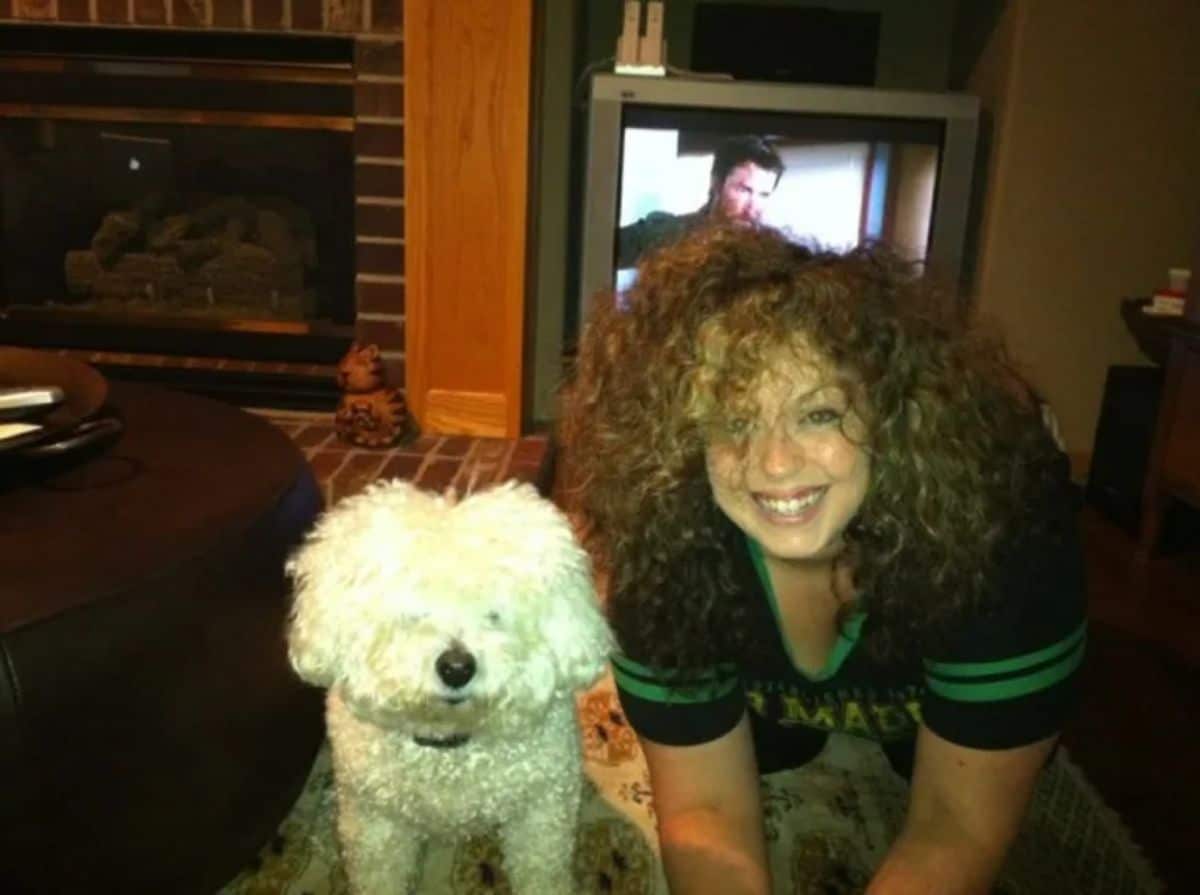 curly white poodle with a woman with curly blonde hair