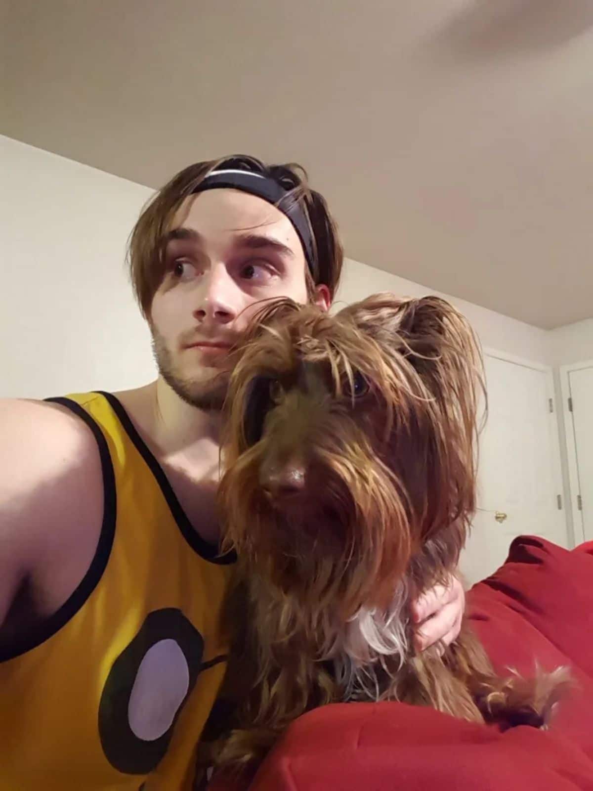 fluffy brown dog and man with similar brown hair
